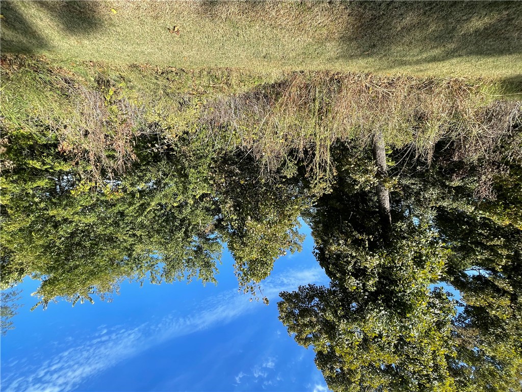This is a nice size lot on the main road of Holiday Island.  It backs up to Hawk Drive.  Build your dream home on the top side of the lot and have a great view off the back.  This lot is central to all of the amenities of Holiday Island that include the Country Club, 2 golf courses, marina, swimming pools, parks, baseball diamond, tennis and pickleball courts and more.  Close to shopping, bank, post office, restaurants and more.  Call today for your tour of the area.