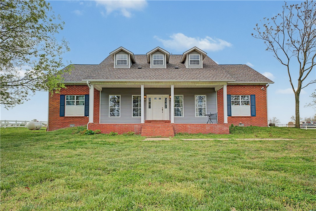 Situated at 20703 Safari RD in Gentry, Arkansas, USA, this single family residence stands in great condition, offering an attractive property experience. The kitchen area provides a welcoming atmosphere, featuring stone countertops that complement the stylish backsplash, creating a refined space for culinary pursuits. A thoughtfully designed kitchen bar and kitchen peninsula offer practical surfaces for meal preparation and gathering, enhancing the functionality of this central area. The presence of a stovetop invites the enjoyment of cooking. The living room offers an inviting retreat, where architectural details like crown molding add a touch of elegance to the surroundings. A comforting fireplace provides a focal point, promising warmth and an ambiance perfect for relaxation during cooler evenings. Within the bathroom, convenience meets comfort with a double vanity, providing ample space for personal routines. A tile tub offers a tranquil spot for unwinding, designed for moments of serene repose.