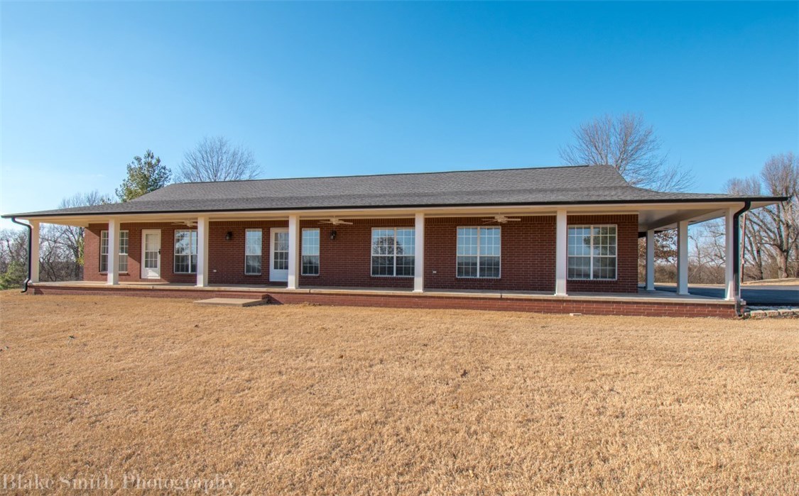 This truly is a one of a kind property: How about 8 acres with a view for miles, two master suites with their own bathrooms, a swimming pool,and a 40x60 workshop/barn/basketball court. And all this in the heart of Johnson just minutes from I49, shopping, commercial, just about anything you need! With the development going on in the area the possibilities are endless. Additional 1 acre and 2,800 sq. ft. 3/2.5 bath home available contiguous to this property.