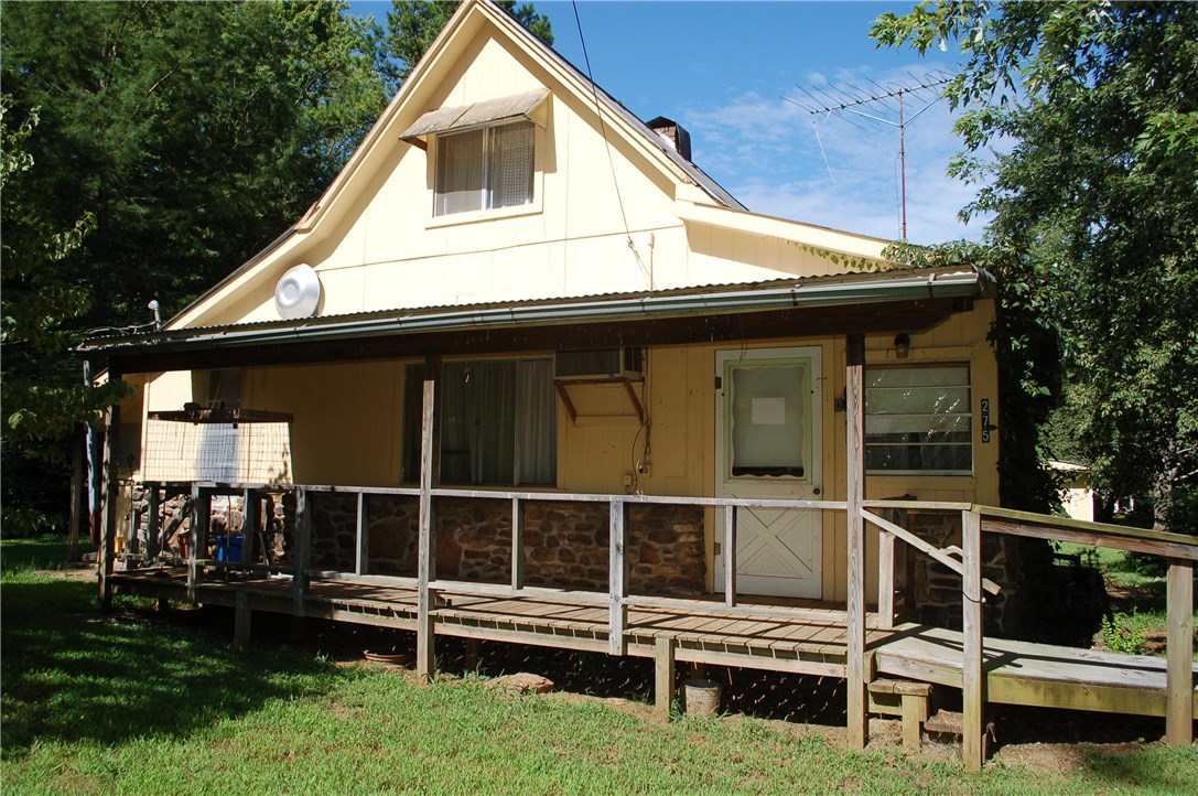 Charming older home needs someone to move in and do some repairs.  Beautiful lots, several outbuildings, completely fenced, refrigerator, washer, dryer and microwave convey.Three bedrooms onebath.   Home being sold "As IS, Where IS" A/C does not work.  Ventless gas heaters.  Leak in bathroom under the sink.   Seller will not owner financing or rent.  Could be a lovely home, once again in a quaint small town in rural Arkansas.
