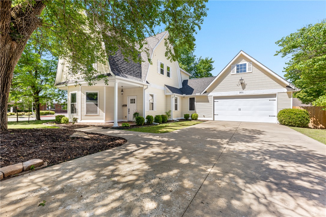 Tucked into the heart of downtown Bentonville, this charming home captures the essence of timeless character and classic appeal!  Ideally situated just across from the neighborhood school, it offers both convenience and a welcoming sense of community. From the moment you arrive, it feels like home with the large mature trees and beautiful curb appeal.  Inside, warm architectural elements create a space that feels both nostalgic and comfortable.  Large windows invite natural light throughout, with cozy living spaces, a formal dining room and great kitchen that is the heart of the home.  Fantastic yard with flagstone patio to enjoy all year round! Whether it’s the subtle details, the established setting, or the unbeatable downtown location, this home offers a special blend of history, charm, and everyday livability.  Perfect for those who appreciate character and want to be close to everything downtown has to offer, this is a truly unique opportunity to own a piece of Bentonville charm