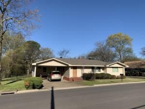 Dine in with this quant and cozy kitchen!  Great location, fenced in, and on 2 city lots with a storage building as well.   Real hard wood floors thru out and lots of space in the laundry room.  Tankless water heater and an updated tiled walk in shower round out just some of what makes this perfect for your new home.  Call Today!!