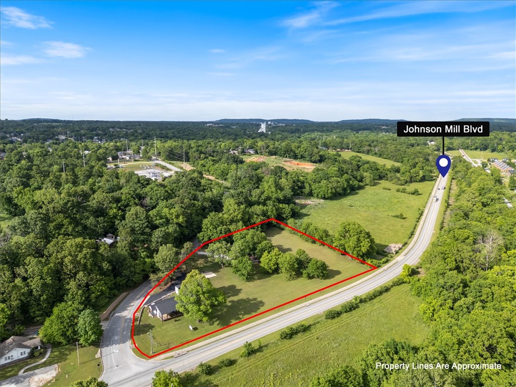 Lots of opportunities with this turnkey office on 2.66 acres! Practically new, the office building was rebuilt down to the floor boards in 2022. With flexible spaces, kitchen/breakroom and two half baths, this space is ready for your business.  Includes a huge deck, parking lot and new, detached storage building. An existing slab next to the parking lot is ready for a new structure.  The property is zoned Urban Neighborhood 2 allowing for a variety of uses including multifamily.  Located steps from The Warehouse District at Johnson Square - a 79,000 square foot planned development of office, retail, medical and residential - this property is uniquely situated for its own growth.