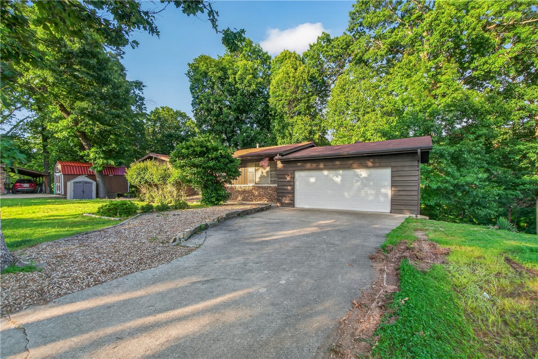 Close to Prairie Creek State Park and Marina! Opportunity awaits with this 2,292 sq. ft. home located in Beaver Lake area! Built in 1966, this property offers solid potential for investors, flippers, or buyers ready to create their own custom retreat. Major updates already completed include a new roof in 2019 and HVAC replaced in 2015.  Septic system is empty and new septic lines were installed.  The main level features 2 bedrooms, including a primary bedroom with a half bath, plus an additional full bathroom. The basement includes 2 more bedrooms and another full bath, providing plenty of space and flexibility for renovations.  This home is in need of a full remodel and is being sold as an excellent fixer-upper opportunity with endless possibilities. Whether you're looking for your next investment project or a home to renovate and make your own, this lake area property is full of potential.  Home is being Sold AS IS!