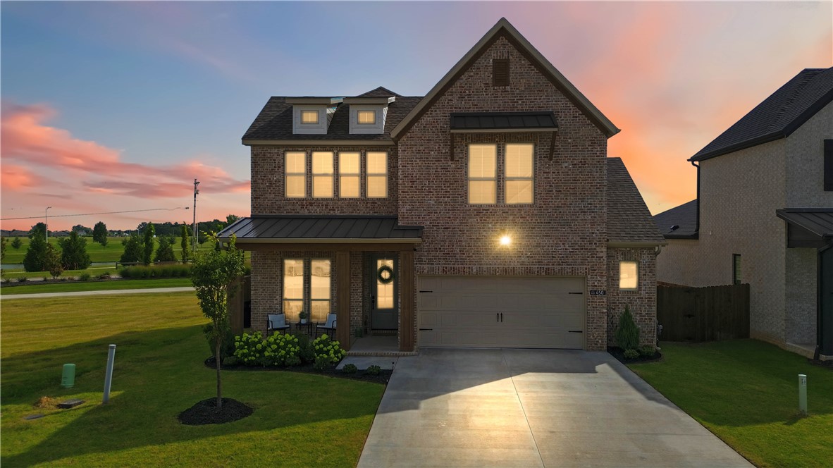 Welcome home to Parkside, one of Elm Springs' most sought-after neighborhoods by Buffington Homes! This stunning Gramercy B floor plan offers 5 bedrooms, a bonus room, and 3.5 baths designed for the way families actually live.
The main-level primary suite has been thoughtfully expanded with a bump-out, giving you a larger bedroom and an even more generous walk-in closet, plus an oversized garage. A second downstairs bedroom features charming French doors, perfect as a home office or flex space. Upstairs, an additional bedroom with its own en-suite bath makes this home ideal for multigenerational living or hosting guests in comfort and privacy.
Step out onto the patio and take in the view of the neighborhood pond fountain — your own peaceful retreat right outside the door.
Location doesn't get better than this. You're steps from Shaw Park, with its dog park, walking trails, splash pad, and ball fields, and just 20 min. from the Walmart Home Office campus. Convenient to everything NWA has to offer.