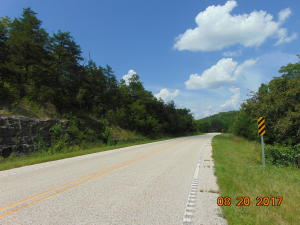 8 lots, parcel's 210-00001 through 8 - 000 equaling 40 acres m/l ready to develop or hunt on. Close too Nature Conservancy land, the canoe livery on the Kings River, and the Berryville Parks Pension Mountain Mixed Usage Trail; lots of springs flowing; dogwoods, redbuds, oaks, hickories, cedars, maples and lots of wildflowers; beautiful view of Pension Mountain.  Highway 221 frontage and across the highway, Madison county refuge.  Trigger gap is just down the road