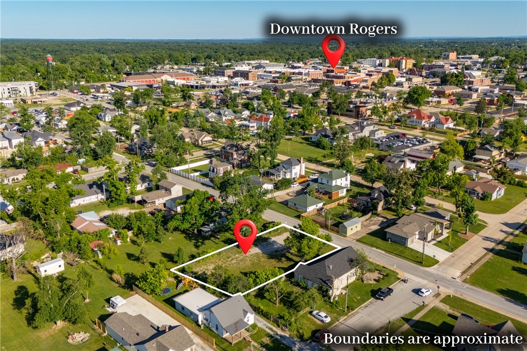 This prime lot is steps away from Downtown Rogers and ready for your vision! With easy access to all the downtown attractions, dining, shopping, and events, this property is perfect for a variety of uses. Offering endless potential for development or investment, this property is perfectly positioned to combine small-town charm with big-city amenities and walkability. It has the potential to be rezoned for flexible use as well! Don't miss out on the opportunity to own a piece of one of the fastest-growing areas of Arkansas.