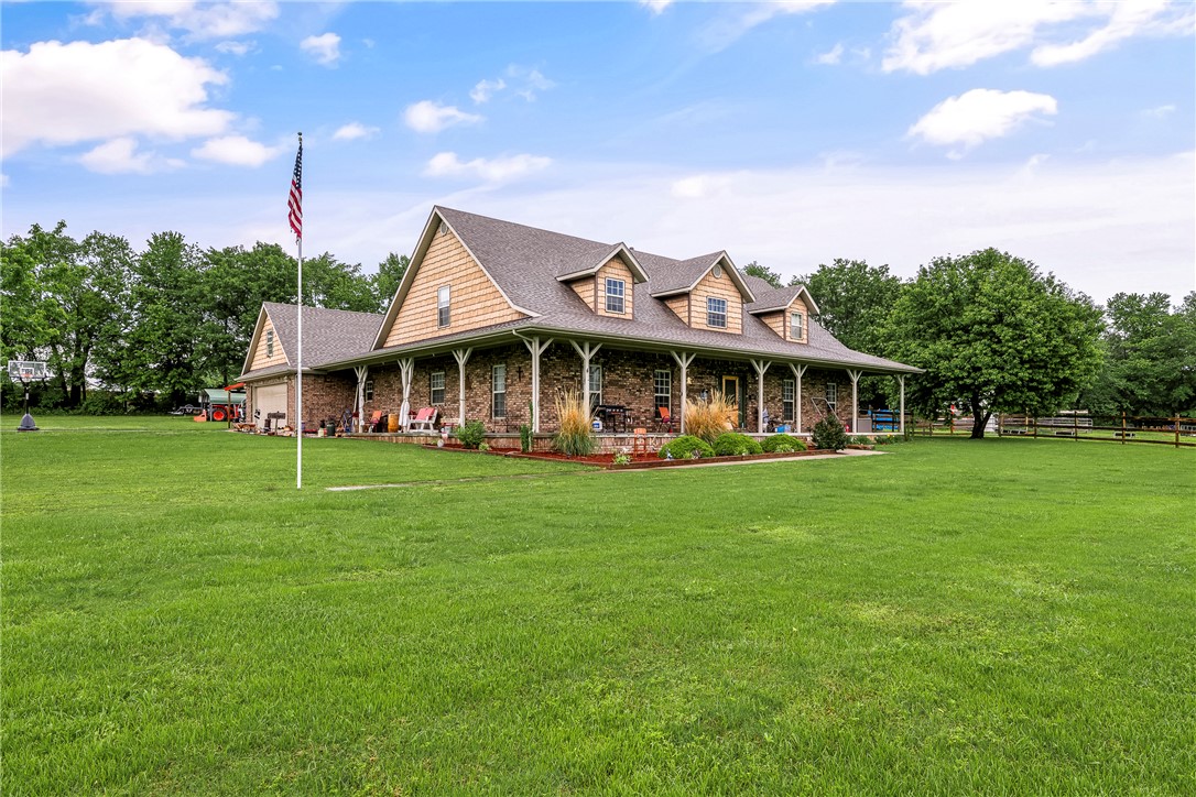 Enjoy perfect blend of country living and city convenience with this spacious property set on 9 beautiful acres within city limits. This unique home features 3 bedrooms, each has its own private full bathroom, plus additional 2 half baths-ideal for comfort and privacy.  Also room just for office w/o closet. Conveniently located near schools and a park, the home has been updated with a new roof (2025) and new flooring in the living areas & primary bedroom. The kitchen is designed for both style & function, offering granite countertops, pull-out cabinetry for easy storage, and a large walk-in pantry. Home has been freshly painted. Upstairs is entertainment room or used for hobbies or make into extra living space.  Outside, a newer 2,400 sq ft shop complete with half bath and its own septic system—perfect for projects, storage, or a home-based business. Additionally, a 32x60 wood shop provides the ideal space to pursue hobbies or craftsmanship. Seller offering 20k in buyer concessions.