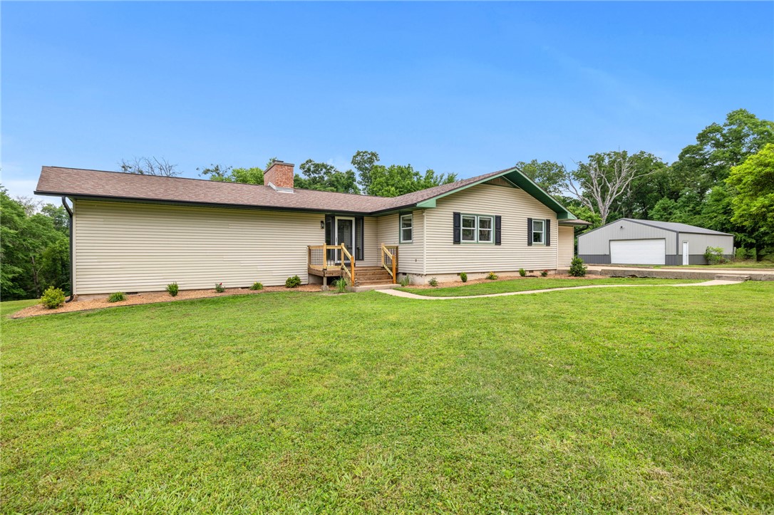 Move-in ready, fully remodeled, and complete with a heated and cooled 1,200 SF shop on 3.13 acres—this property offers the space, updates, and versatility buyers have been searching for. This 4-bedroom, 2-bath home features nearly 2,300 square feet of thoughtfully updated living space with modern finishes throughout. Outside, enjoy a blend of open yard and wooded privacy, creating the perfect balance of usable land and natural beauty. The insulated shop features a pull-through design, making it ideal for hobbies, storage, equipment, recreational vehicles, or a home-based business. Conveniently located just minutes from Gravette, Centerton, Bentonville, and Bella Vista, you'll enjoy peaceful country living without sacrificing access to Northwest Arkansas amenities.