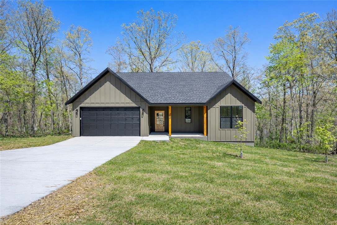 Interest Rates as low as 3.75% available for qualified buyers when using Builder's Concessions, plus an additional $3,000 preferred lender credit available. Ask for details.

 Beautiful new construction home in Bella Vista situated on a secluded wooded lot with a covered back deck perfect for relaxing or entertaining. 

This thoughtfully designed home features two bedrooms and two full baths on the main level, plus an additional bedroom and full bath upstairs. The spacious primary suite includes dual walk-in closets, a freestanding soaking tub, and a custom tile walk-in shower. Main living area features an electric fireplace with an open, inviting layout. 

Additional features include tile showers in all bathrooms, quality finishes throughout, and a two-car garage. Conveniently located near Bella Vista amenities, golf, trails, and lakes. 

Agent Owned. This house has 3 rooms but a 2 bedroom septic system.