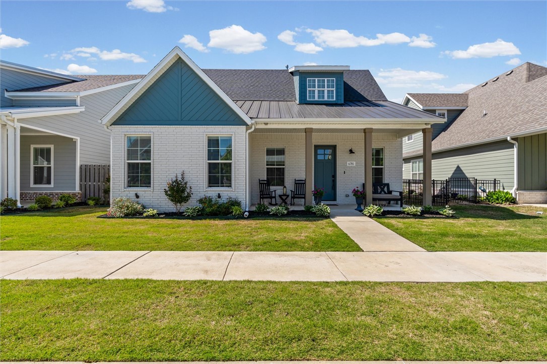 Welcome to this custom home by Landmarc that blends spacious living & low-maintenance lifestyle. Featuring 10ft ceilings & 8ft doors downstairs, 9ft ceilings upstairs, & large rooms, each w/private ensuite plus a powder bath. Kitchen offers ceiling-height cabinetry. Custom upgrades include built-in bookshelves, enhanced cabinetry, dining room window seat, upgraded living room light fixture, ample storage & pull down attic storage w/full decking above garage. Private office nook w/ glass door & extended HVAC creates perfect WFH space. Homeowners added wood floors in master bedroom & updated tile in primary bath, mudroom, powder bath, & laundry room. Enjoy welcoming front porch neighborhood with seasonal events & weekly clubhouse gatherings. Nearby Shaw Family Park offers trails, playgrounds, pickleball/tennis courts, ballfields, dog parks, fitness area, splash pad & picnic shelters! POA fees cover lawn/landscaping services, including ornamental plant maintenance, mulching, irrigation, weed control, & mowing/edging.