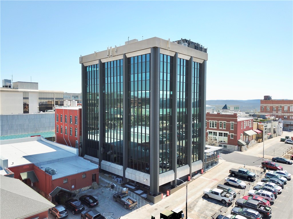 Class A office building located just steps from the Fayetteville Square and the historic Downtown Fayetteville. Amenities in the building include bike storage, locker rooms, common area with seating, and on-site bar in the basement. Many local restaurants, shops and bars in the immediate area.