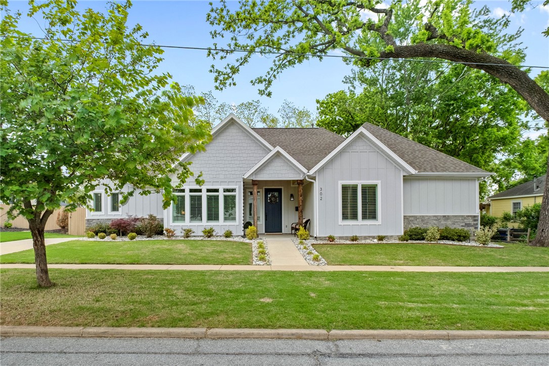All things Downtown Bentonville covered with this beautiful 4-bedroom+office, 3 1/2 bath, Craftsman-style home! The home is split with a spacious 2800 sq ft open floor plan lower level and a 860 sq ft outside access 2nd level apartment, which the owners use as a revenue generating short-term rental. Lower level was created to incorporate the adult-style pool w/ outdoor cooking space, covered patio w/fireplace as an extension of the lower level of the home with the multi-slide Marvin doors. If you enjoy hosting friends, family and neighbors, this home is the ticket! Upstairs apartment is 1-bedroom, 1-bath w/ full kitchen that has never received less than a 5-star rating (E Street Escape) as a short-term rental. Shed behind the garage provides storage for guests visiting to explore Bentonville world class bike trails. Guests have easy walking access to all things Downtown Bentonville regardless if they're bikers or not. Downtown Bentonville gem!!