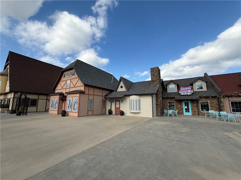 Prime retail space in Farmington Village — a uniquely designed shopping center with European storybook architecture located right in the center of town on Main Street. This 1,014 SF suite features Main Street frontage and backs to Creekside Park. All other spaces in Farmington Village are long-term lease tenants including a spa, ophthalmologist, physical therapy clinic, and counseling practice. 57 parking spaces with ample lot parking. Farmington is one of Arkansas's fastest-growing cities with 38% population growth since 2020 and 260+ new homes permitted in 2025. Walking distance to Farmington schools (2,900+ students), 0.3 miles to Walmart Neighborhood Market. Just 5 miles to the University of Arkansas, 7 minutes to I-49, and 10 minutes to downtown Fayetteville. Sign allowed. $2300 Per Month + $150 CAM