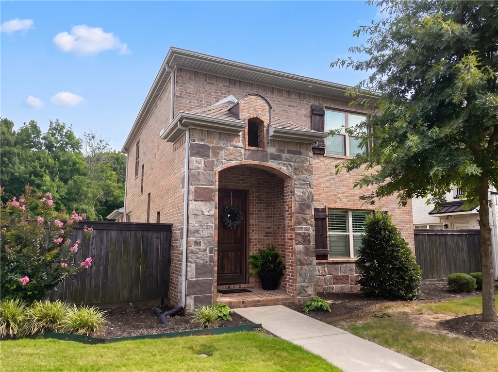 This gorgeous home is located in the highly desirable Forest Hills community in Fayetteville. Featuring 3 bedrooms and 2.5 bathrooms, this beautifully crafted residence welcomes you with a stunning two-story entryway lined with brick that sets the tone for the quality throughout. The kitchen offers granite countertops, custom white cabinetry, and a bright, modern layout perfect for everyday living and entertaining. Spacious bedrooms, thoughtful design elements, and stylish finishes make this home stand out from the rest. With its charm, craftsmanship, and prime location, this home is truly a MUST SEE! HOA provides a pool, dog park, and cares for lawns and sprinkler systems.