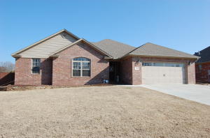 BETTER than NEW!!! You get it all here with a great open floor plan. Hardwood floors, recessed ceiling in living as well as fireplace in living area. Large master suite features master bath with separate walk-in shower and tub as well as two walk-in closets. Completely privacy fenced yard out back with covered porch for relaxing and grilling out! Come and see all this home has to offer today.