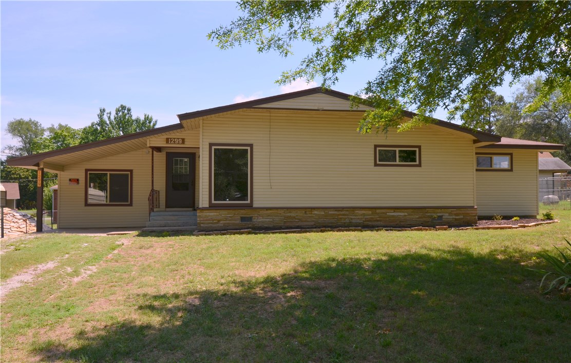 Nicely Updated Home With A Lot Of "New" To Enjoy. Situated On A Spacious 0.41 Acre Corner Lot. Open & Bright Living Area. White Painted Cabinets In Kitchen w/ Granite Tops, SS Appliances, Eat-in Dining Area. Master w/ Attached 1/2 Bath. 2 Other Beds + Additional Bonus Room. Sliding Door Leads To Lg Back Deck. Large Carport + Detached Garage. Buy For Zero Down! Come Check This One Out Today!