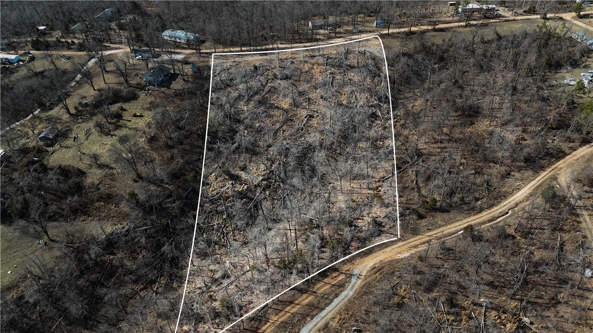 Discover 5 acres in a prime location just 7 minutes from Hobs State Park, 13 minutes to the lake, and 6 minutes from Pigeon Roost Trailhead. 
You don't want to miss out on this rare chance to own land in such a desirable area.