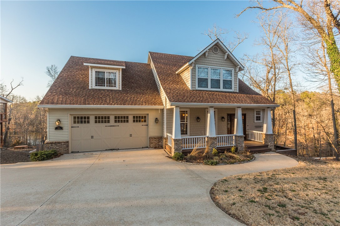 Lakefront living at its best on Lake Rayburn! Fantastic lake views from all over the Craftsman-style house and screened-in or open deck areas.  Gentle walk to the lake for enjoying this beautifully scenic and quiet area of the lake. Great area to fish or kayak! Newer construction on Bella Vista’s East side that’s very hard to find. Great layout and room for family. Upstairs bonus room could be 4th bedroom. Ex room upstairs perfect for guests, exercise, craft room or office! Bentonville school district!