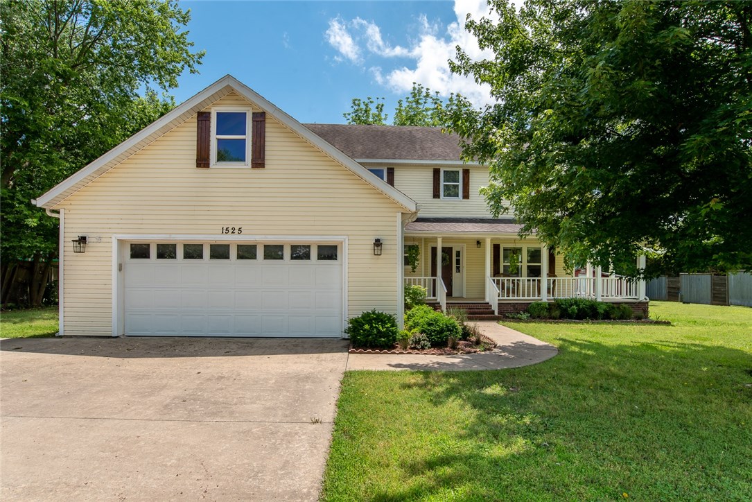Charming two story home in a great location, close to Fayetteville school district.  High sought after area is perfect as an investment property with amenities such as a two car garage,  covered front porch and wooden back deck and a large, privacy fenced in yard. This home has 4 bedrooms, 3 full bath, and a half bath with large eat-in kitchen & living space with specialty room, and sunroom. Hardwood floors throughout main living space with wood fireplace.  Home has a semi-open floor plan with additional play room or dining area. Carpet in bedrooms. Master bedroom has master bath with tub/shower combo.  Laundry area comes with washer and dryer connection and ample upper cabinets for storage. This property even comes with a rentable apartment! A property you won’t want to miss!