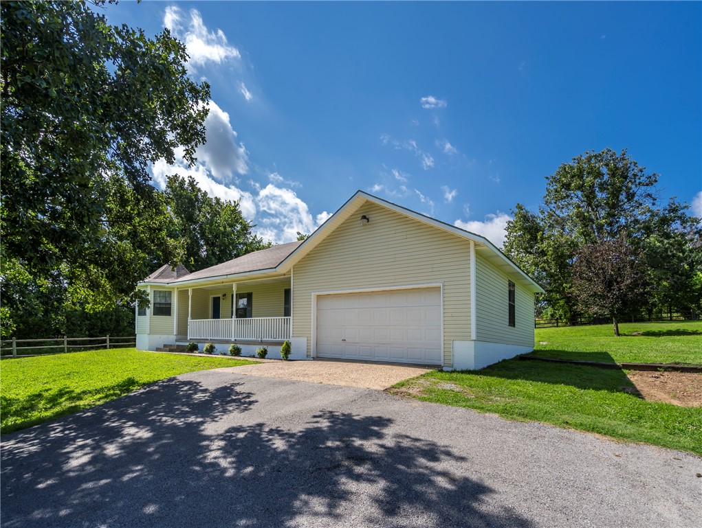 Presenting an exceptional opportunity to purchase a home on 2.24 Acres in the Goshen area! This single-family residence, constructed in 1996, is distinguished by its thoughtful design, providing a harmonious blend of comfort and functionality. Seller has a new roof scheduled to be installed in July. Home is ready for a cosmetic update allowing the buyer to make it their home to their taste. The residence encompasses three well-appointed bedrooms, each designed to offer privacy and comfort. Complementing these are two full bathrooms. Wood burning fireplace with a vaulted ceiling in the living room feels roomy and cozy all at the same time. This property, with its considered layout and prime location, represents an unparalleled offering for discerning buyers.