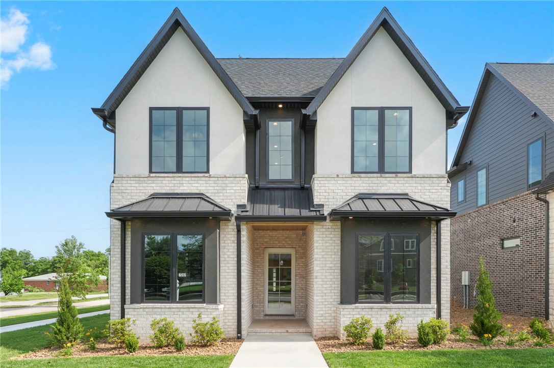 This custom-designed home in Northwest Arkansas's most desirable street, Central, offers prime location and convenience! This home is located near shopping, restaurants, Bentonville's Square and the famous Walton Museum. The home features 10 ft ceilings and luxurious finishes throughout. The gourmet kitchen boasts high-end appliances and a walk-in pantry, perfect for the home chef. Enjoy outdoor living with an extensive covered back porch with a custom outdoor kitchen! Ideal for entertaining. This home offers both elegance and functionality, combining modern design and comfort. Don't miss out on a chance to make this home yours! Home is completed and move in ready!