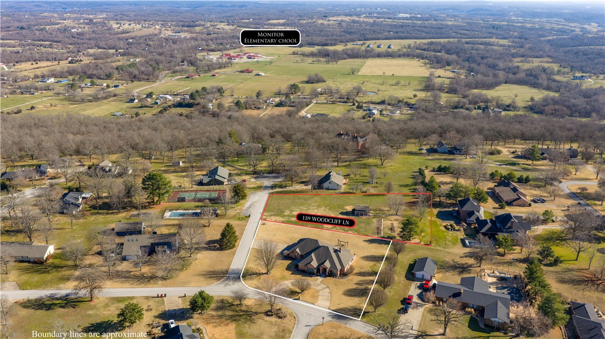 Fantastic 1.35-acre lot in the highly desirable Woodcliff subdivision of Springdale! This rare property features an extremely well-built brick shop/outbuilding complete with a garage door and upstairs storage, offering incredible functionality and versatility. Electric service is already in place with its own meter, along with an impressive 723-foot-deep well. The level, beautifully maintained lot features established landscaping and fruit-bearing plants including three pecan trees, grapes, black raspberries, red raspberries, blackberries, figs, and muscadines — creating a one-of-a-kind setting that’s increasingly hard to find in Northwest Arkansas. Ideally located directly across from the neighborhood pool and tennis courts, this property offers the perfect blend of privacy, convenience, acreage, and community amenities. Exceptional opportunity to build your dream home in one of Springdale’s most established and sought-after neighborhoods.