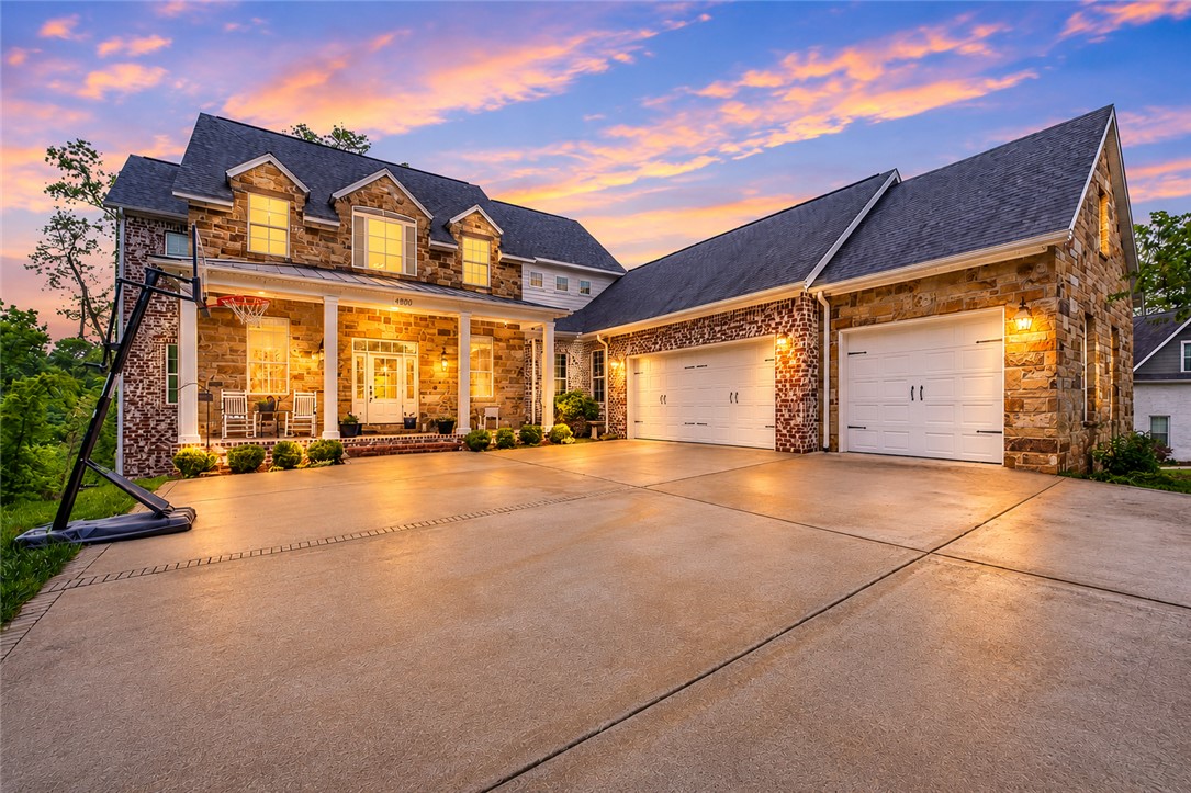 Experience luxury living in the prestigious Versailles neighborhood with this stunning custom-built home designed for both elegance and functionality. The open-concept kitchen, living, and dining areas create a seamless flow ideal for entertaining, while expansive windows showcase beautiful wooded views and fill the home with natural light.
Upstairs, the private primary suite offers a relaxing retreat with a spa-like ensuite bathroom, while two additional bedrooms are connected by a Jack-and-Jill bathroom. The finished walkout basement adds exceptional versatility with a large bonus room, abundant storage space, and a gym area already plumbed and ready for the option of a future kitchenette—perfect for guests, multigenerational living, or entertaining. You will also find two additional bedrooms and full bath.
Enjoy privacy, scenic surroundings, and the opportunity to also add more privacy or possibilities with the adjoining lot available for purchase for $200,000. See MLS # 1345393.