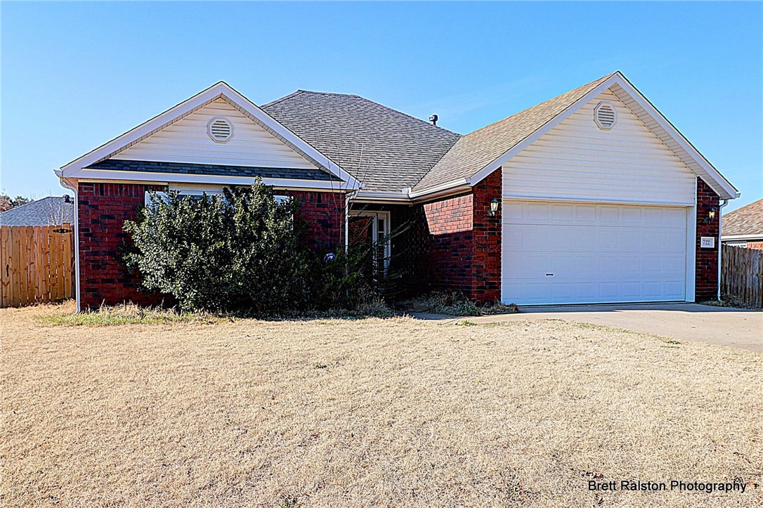 Super buy! Ready for personal touches. Your family will feel right at home in this 3 BR, 2 BA home with gas fireplace, 2 car garage, & eat-in-kitchen. Backyard privacy fence & garden. Easy care inside & out. What a house!
