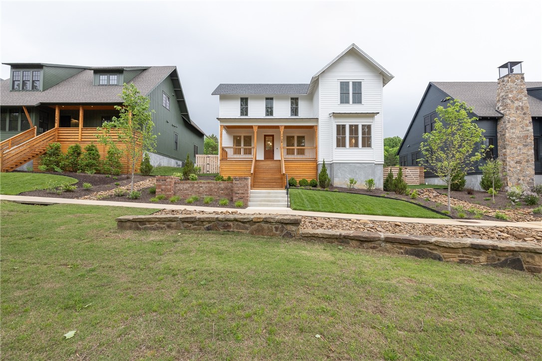 LOCATION, LOCATION!  Situated amongst the tree tops of the University of Arkansas’s iconic Markham Street, this new construction home is a head turner!  2,683 heated sq ft offers 4 bedrooms, 3.5 bathrooms, open eat in kitchen to living room, separate laundry, mud room, and upstairs bonus/loft!  The amenities include BEAUTIFUL wood PELLA windows, REAL sand and stain hardwood floors, upgraded carpet, designer light fixtures, quartz counter tops, tile surround showers, a 5 burner gas range, wood privacy fence, and a rear loading 2 car garage.  Leave your front door and walk right to the new Stonebreaker hotel and restaurant or left to Gate 1 of the football stadium. Please don’t MISS the size of this LOT!!!  It is 0.36 acres and has an additional lot with its own address which would be perfect for an ADU!!  This truly is a remarkable location!