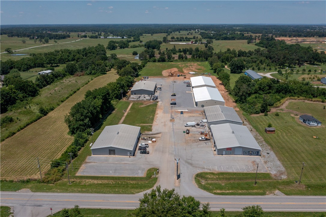 This well-positioned commercial asset features 100% net-leased tenants, providing stable income with minimal landlord responsibilities. Located in the rapidly expanding Centerton corridor, the property offers excellent access to Bentonville, Rogers, and key regional transportation routes, placing it at the center of Northwest Arkansas’ continued growth. The region is experiencing strong and sustained demand for industrial and flex space, driven by population and economic expansion in one of the fastest-growing markets in the U.S. All buildings are equipped with roll-up and/or drive-in doors, supporting efficient operations for a variety of users. Additionally, the site includes approximately four acres of vacant land, offering a valuable opportunity for future expansion or redevelopment.