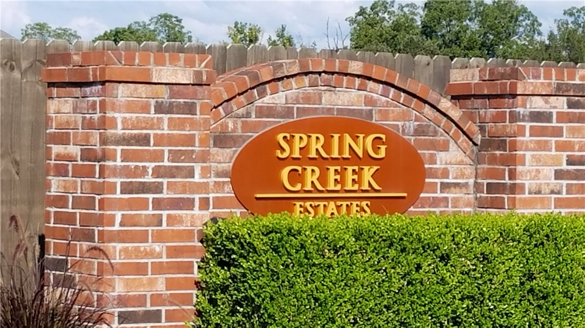 One of last 2 lots in beautiful Springdale subdivision.  All utilities on site.  Has gentle slope in back.  Has fencing on one side from an existing home.  Houses in subdivision have 1500 square foot minimum.  Exterior wall area, excluding windows, doors and gabels, must be 100% brick or masonry.