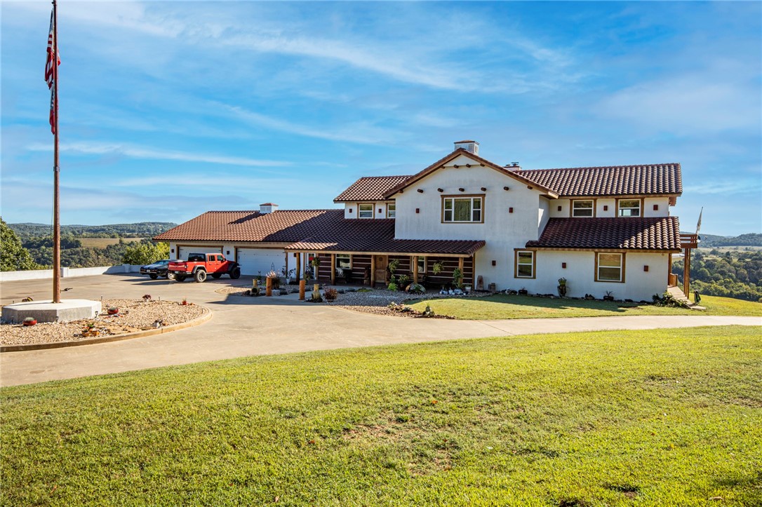 5 bed/4 full bath/2 kitchens. 5,980 sqft living space. 2,900 sqft basement. Spanish title roofing. Flooring stained concrete/wood laminate. Formal dining room/open concept. Foyer ceilings 20 ft tall. In home Elevator. Vinyl fencing, waterfront Wharton creek, 2 ponds/creek on property with private waterfall lagoon! Ample outlets inside/exterior of home. Finished cabin w insulation/cedar walls/tile floor/stove. Landscaped for above ground gardens/concrete slab for shed/green house, LR has 180 degree views of property/Ozark/mnts/valley w tons of natural light, structure has about 1 million pounds of concrete. 4 car garage/additional space below. Covered RV port w electrical 30 amp. 360 degree views from patios. Home extremely energy efficient. Sits on 95 acres. Home has two wood burning stoves,2 h20 heaters,2 HVAC's/4 separate patio decks. 15 min to Ponca where elk and bears free range/20 min to Buffalo River/30 min to Beaver Lake/30 min to Eureka Springs/5 min to shopping necessities/35 min to Fayetteville. Paradise