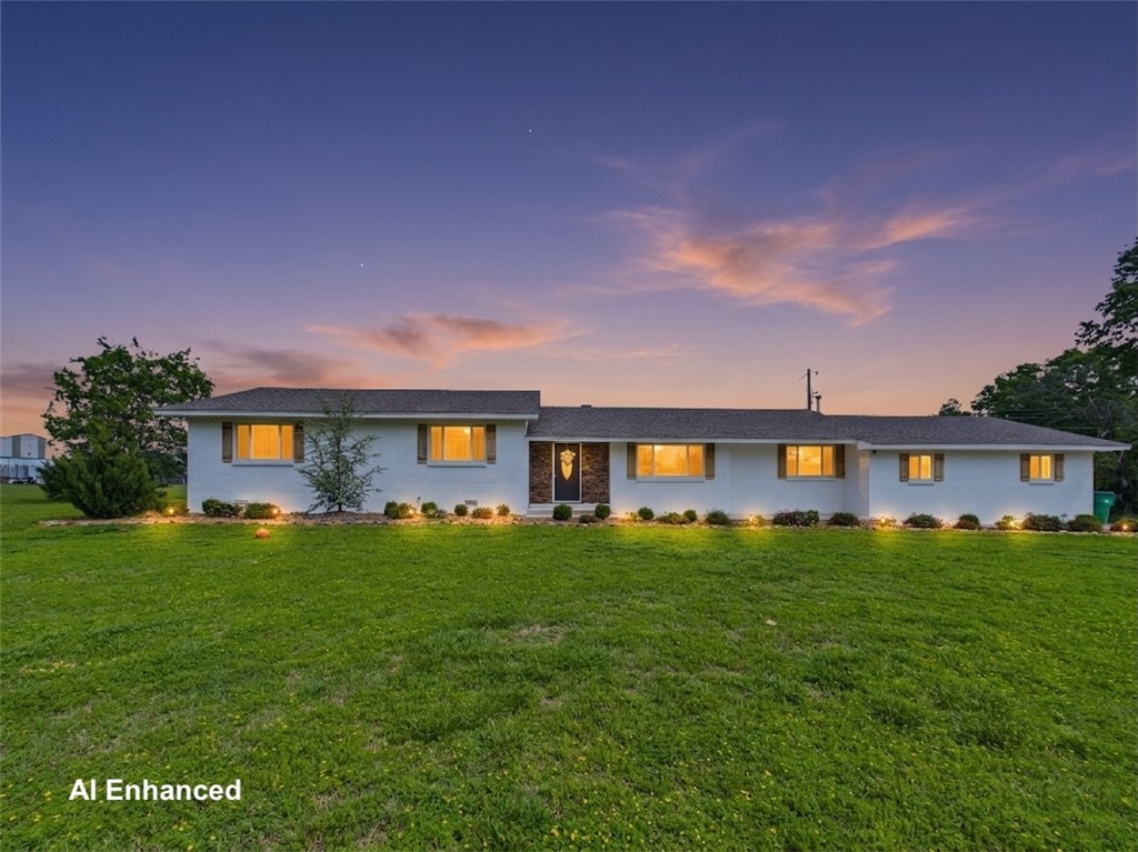 Rare opportunity to own a beautifully updated mini ranch on 5 acres in Rogers! This 3BR/2.5BA ranch-style home offers 1,968 SF and a hard-to-find combination of land, pool, horse stable, and modern comfort. The 1,380 SF horse barn/stable includes electric, water, 3 stalls, tack room, and hay/feed storage. The pasture is partially fenced with solar electric fencing. Enjoy summer days in the inground pool surrounded by stunning landscape rock accents. The private primary suite opens directly to a covered patio and pool area. Inside, you'll find both a living room and family room for flexible living and entertaining. The kitchen features a large window over the sink with scenic views of the pool, pasture, and barn. Peaceful rural setting with the convenience of shopping, dining, and amenities just minutes away in Pea Ridge. A rare lifestyle property that’s difficult to find!