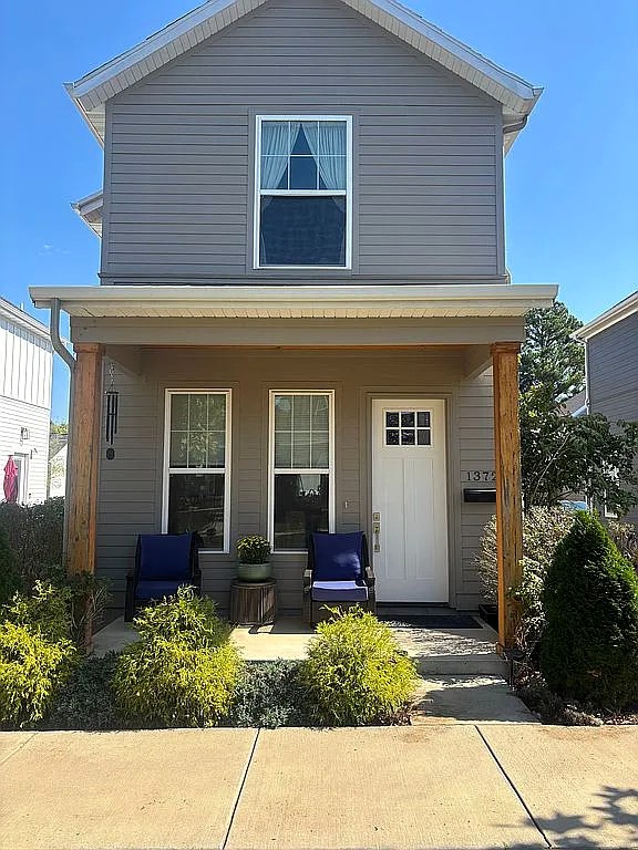 Welcome to Southside Fayetteville! This modern craftsman home provides the amenities and upgrades of large living with the low costs and maintenance of a modest newer home just 3 minutes to the University of Arkansas, so perfect for students, as they can walk or ride a bike to class. Open concept living space with 10 foot ceilings on main level. Gas log fireplace with a solid cedar mantle and stunning surround. Accent wall and  storage below the stairs. 3 cm quartz counters, custom cabinets, extra pantries, subway tile backsplash and new upgraded stainless appliances adorn the kitchen. The solid wood stair treads and modern handrail lead you upstairs to a split plan with a reading or storage nook at the landing. Primary ensuite features a beautiful double vanity and custom full tile walk in shower. Primary has walk-in-closet and vaulted ceilings with large windows beaming natural light. Second bedroom has beautiful tile work and a walk in closet. The perfect investment in your student or to add to your portfolio!