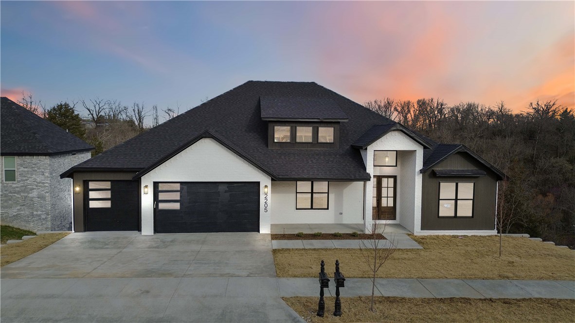 Nestled on a sprawling, tree-lined, rolling hills of Bentonville this beautifully curated 5-bedroom, 4 bath home epitomizes modern elegance within the Grammercy Subdivision. Designed to harmonize style and function, the first floor boasts an open-concept living and dining area graced with soaring ceilings, accents, abundant natural light, custom built-ins, linear fireplace. The elegant kitchen is a culinary dream, featuring a stunning quartz island, custom black and  oak cabinetry, premium appliances, and a walk-in pantry. The primary suite presents a spa-like ensuite with a huge shower, soaking tub, dual vanities,  and an expansive closet with built-ins.Second level three spacious bedrooms and a dedicated Living area offer versatility and ample storage. Media room equipped with Surround wiring and led Wall strip Lighting add to the home's allure.Enjoy ultimate privacy in the tranquil backyard, perfect for entertaining. Schedule your showing today!
Agent Owned.