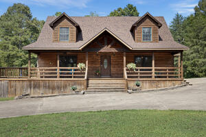 This 2,175 sq. ft. home on 3.44 acres offers a blend of comfort and country living. It features 4 bedrooms, 2.5 baths, a cozy fireplace, and cathedral ceilings. The kitchen includes a bar, perfect for casual dining. The main floor includes a spacious primary bedroom, with three additional bedrooms upstairs. Enjoy outdoor living on the wrap-around decks or in the 18'x33' above-ground pool. The 30'x40' detached shop is equipped with electricity, a bathroom, and more. The roof is less than 5 years old. Just 10 minutes from Russellville.