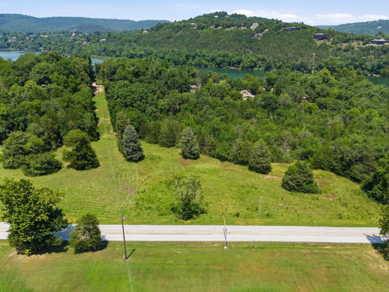 Gorgeous 3 +/- acre lot in the quaint town of Beaver. Just steps from the 100 year old wooden bridge and Beaver Campground and swim beach you will find your next forever. Your tranquil lake life is just around the rivers bend in Beaver Arkansas.