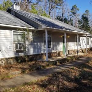 This home offers privacy and seclusion just 4 miles from Clarksville! Sitting on a beautifully wooded 6.9 Acres +/-, this spacious 1800 sft(per tax records), 3 bed 2 bath home has a new roof as of 2019, new central heat and air heat pump in 2013 w/ new indoor coil and coolant in 2019. New dishwasher in 2018. Easy maintenance at only 15 minutes mow the lawn! . Walking trails and park benches on property, wood burning fireplace, open floor plan and priced to sell, call for your showing today!