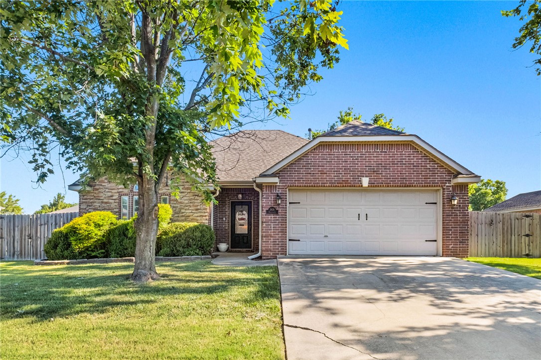 Beautifully maintained 3-bedroom, 2-bath home in the Fayetteville School District! The open floor plan is perfect for everyday living and entertaining, featuring wood floors, high ceilings, crown molding, a cozy gas fireplace, and seamless flow between the living room, dining area, and kitchen. The kitchen offers granite countertops and pantry. The spacious primary suite features a tray ceiling with crown molding, private bath with a jetted tub, walk-in shower, double vanity, and walk-in closet. The front bedroom has a vaulted ceiling, large round top window for lots of natural light and plant shelves for added character. Step outside to enjoy the privacy-fenced backyard with an oversized patio, gas hookup for your grill, storage shed, and double gate access. Conveniently located near I-49, shopping, restaurants, parks, and the University of Arkansas, this home offers easy access to everything Fayetteville has to offer while being tucked away in an established neighborhood.