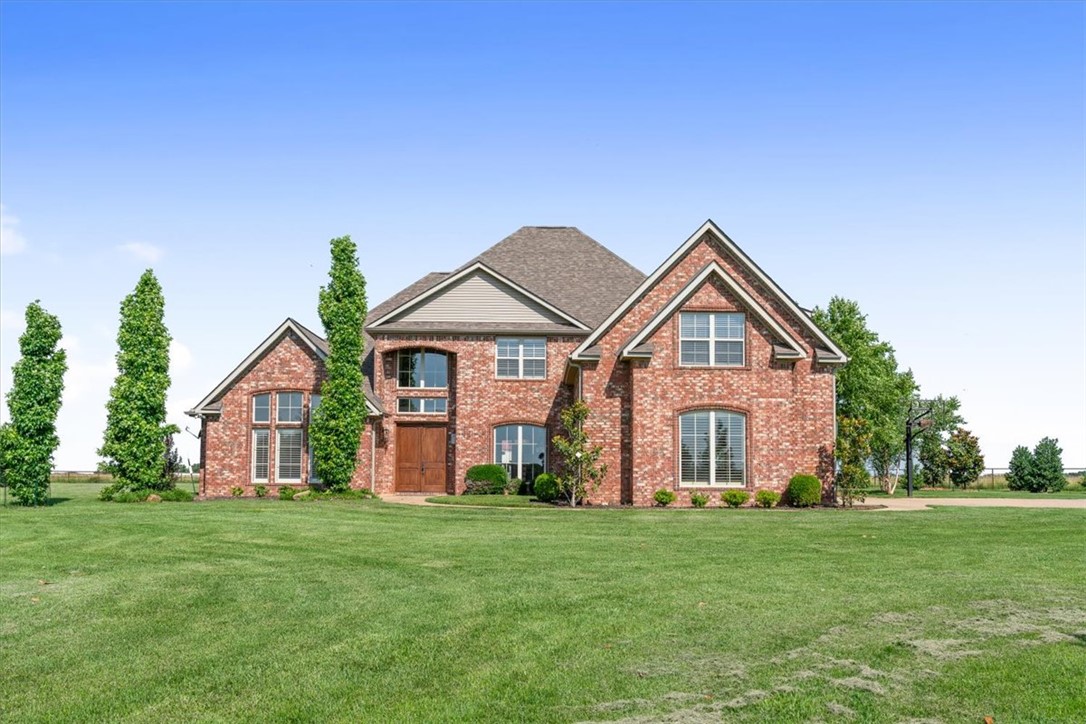 This spacious home offers over 3900 sqft of living, including 4 bedrooms (primary suite and study on main floor), 3.5 baths and a dedicated study.  Inside, you'll find beautiful red oak hardwood flooring, elegant crown molding, plantation shutters, and a welcoming foyer accented with brick pavers.  The newly renovated gourmet kitchen is equipped with stainless steel appliances, abundant cabinetry, oversized gas cook top, double ovens, and a large pantry.  Retreat to the primary suite, featuring an oversized bedroom with beautiful bow windows that create the perfect sitting area to enjoy your morning coffee with a favorite book. The en-suite bath offers a soaking tub, walk-in shower, separate vanities, and large walk-in closets.   Upstairs offers 3 spacious bedrooms, 2 full bathrooms, and an open bonus room.  Step outside and enjoy your own backyard oasis, complete with a sparkling gunite pool and plenty of room to roam. The 40' x 40' shop offers endless possibilities and includes a large office area and half bath.