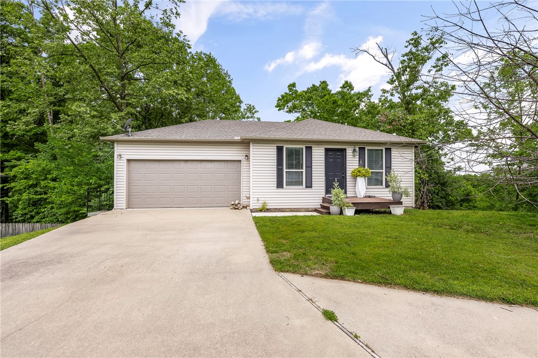 Prime Bentonville Location! Perfectly positioned just minutes from the new WM Campus, Downtown Bentonville, and I-49 access. Tucked against mature trees and backing directly onto Dark Holler and Traverse mountain biking trails, this home is a gem for nature lovers and trail enthusiasts alike. Built in 2016 and recently updated, the home features a walk-out basement with both bedrooms located downstairs—each with its own private en-suite bath. Updates include a new roof and gutters (2024), new flooring throughout the main level (2023), a new refrigerator (2025), dishwasher (2024), and washer/dryer (2023). Open-concept main floor is ideal for entertaining and everyday living, and the wooded backyard offers privacy and scenic views with direct trail access. Whether you're looking for a low-maintenance home base with adventure at your doorstep or a solid investment in a prime NWA location, this one checks all the boxes. Don’t miss this rare combination of convenience, updates, and access to Bentonville’s best trails!