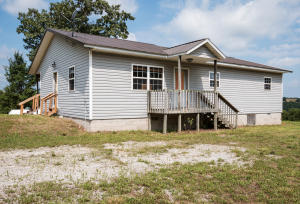 Enjoy the privacy of your secluded ten acres while being only 20 minutes from Branson! This three bedroom, two bath home features a new roof and floor within this past year. The lot is more cleared than wooded and is ready to be explored. Your get-away is waiting for you!