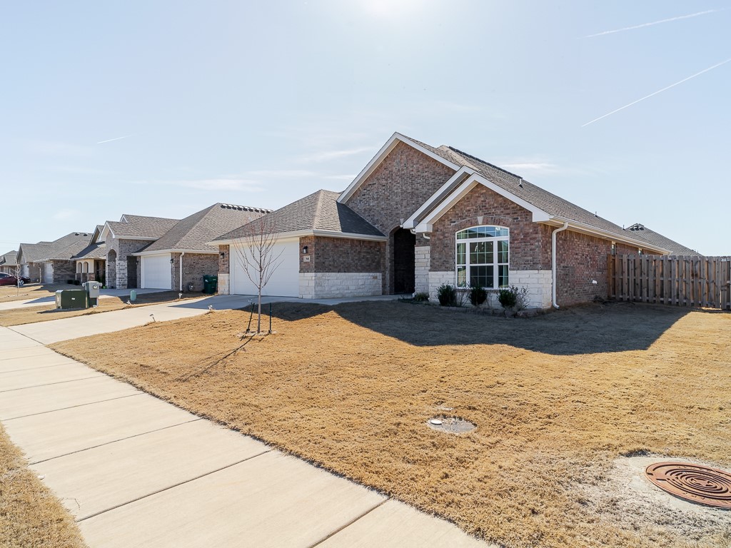 The perfect location and walking distance to Bentonville West. One level 4 bedrooms 3 bath. Lots of natural light with beautiful interior finishes. Open floor plan with large family/living area dining, and kitchen.  Upgraded appliance package, gourmet gas stove, pantry and granite throughout! You will love the island bar area for additional seating. Over 2300 sq. feet of living home. The large master suite offers a spacious walk-in closet, his and hers bathroom vanities, and separate tub and shower. 2 car garage and large covered porch to enjoy with privacy fenced back yard. All adult occupants must complete application. $50/person to apply. Application attached.