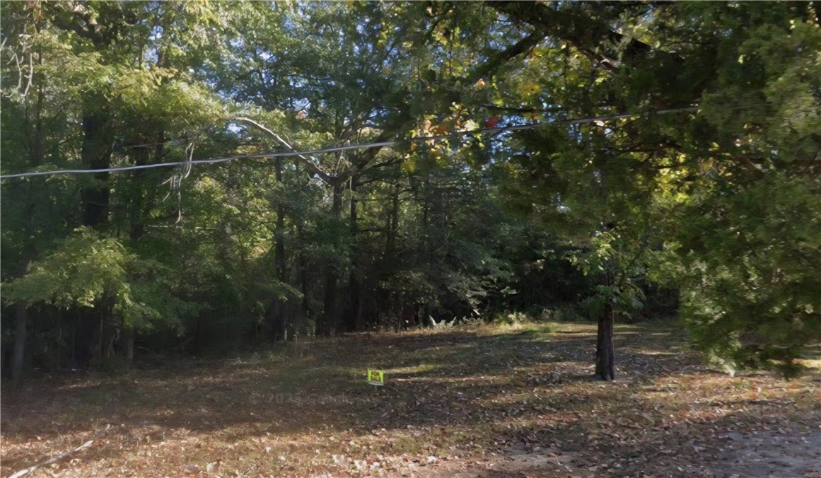This is a flat .16 (+/-) acre lot that is partially wooded and ready for your new home in Pine Bluff. It is close too local amenities and minutes from Lake Saracen. Property conveys a Limited Warranty Deed. Call or text for more information.