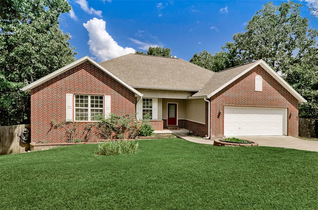 Gorgeous home, open floor plan, beautiful wood floors, crown molding, lots of windows to bring the outside in. Gourmet kitchen opens to the family room, custom cabinets, granite countertops & walk in pantry, Bonus room between kitchen and outside deck to enjoy your favorite book. Large master bedroom and bath, double vanities, whirlpool and walk in shower. Total privacy awaits from the large deck and fenced back yard. Low maint exterior incl  gutters with helmets,  Close to Metfield, Bentonville schools