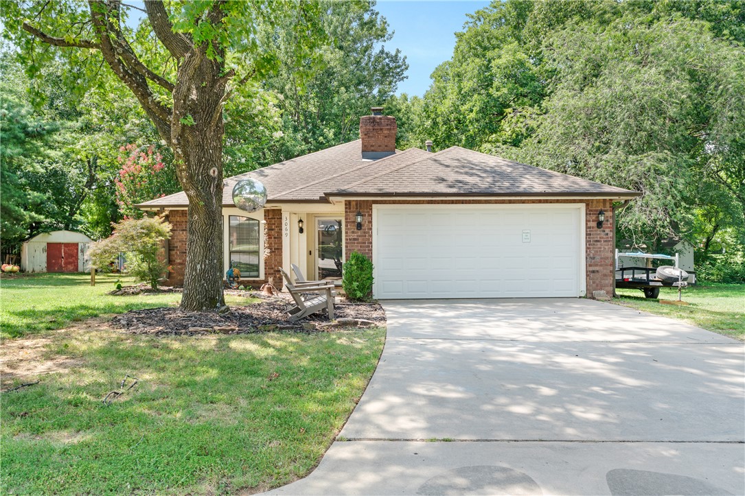 Bright, inviting, and full of natural light, this well-maintained 3-bedroom, 2-bath home offers comfortable living in a desirable Fayetteville location. The spacious living room features a vaulted ceiling and skylight, creating a bright, open atmosphere that flows seamlessly into the dedicated dining area and kitchen, making everyday living and entertaining effortless. A private primary suite includes its own en-suite bath, while two additional bedrooms provide flexibility for family, guests, or a home office. Step outside to the backyard deck, the perfect place to relax, entertain, or enjoy the peaceful outdoor setting. Conveniently located near shopping, dining, grocery stores, parks, schools, medical facilities, and the Razorback Greenway, with quick access to the University of Arkansas and major commuter routes, this home combines everyday comfort with an exceptional Fayetteville location.