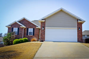 Vaulted ceilings,large walk in closet & laundry room. Partially finished basement has a  large family room with a pool table included. Basement could easily be completely finished adding another bedroom and bathroom. Doggie door leading out onto the large deck and privacy fence. Hot tub stays! Workshop area in the basement.