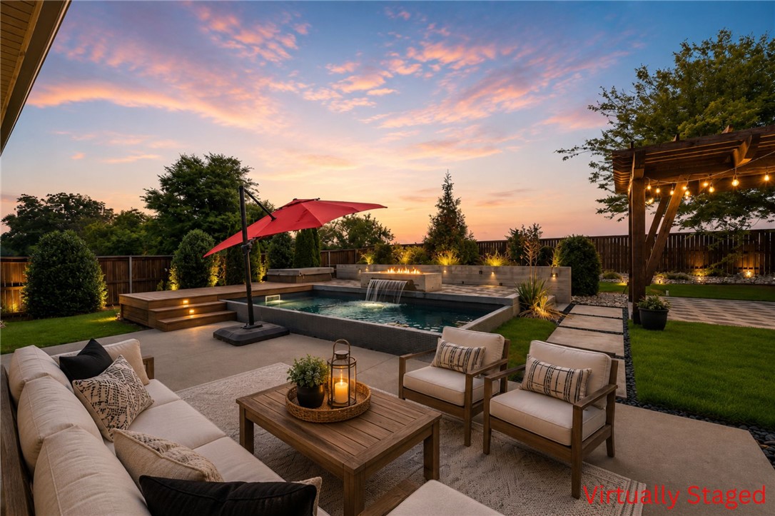 Luxury living awaits in this stunning corner-lot estate, perfectly positioned with the Razorback Greenway bike trail right behind your fenced backyard oasis. Designed for ultimate entertaining, the resort-style yard boasts a heated pool with a waterfall & built-in firepit, hot tub, covered patio, extensive professional landscaping & a pergola wired with gas & electric. Inside, the main level features beautiful wood floors, crown molding, plantation shutters, all bedrooms on the main level & more! The chef’s kitchen is a showstopper, open to the spacious living area & equipped with ceiling-height cabinets, quartz countertops, gas cooktop, double ovens & easy access to the formal dining room with coffered ceiling. Lavish primary suite with wood flooring & spa-like soaking tub & walk-in tile shower. High-end upgrades including a side-load 3-car garage with EV charging, tornado shelter & insulated steel doors, whole-home audio & a massive upstairs bonus room complete with half bath & brand-new 100" TV for you to enjoy!