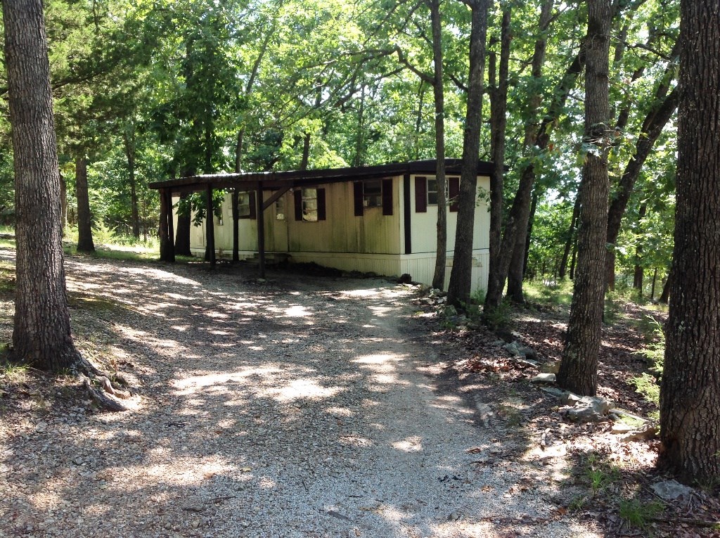 Looking for an economical way to get on the lake in Lost Bridge Village.  Come get this one, it could go fast. 2 BR - 1 B mobile home on two lots. Yes, two lots. Within easy walking distance of the pool, rec center and the lake. Refrigerator and stove/range convey. Other LBV amenities: tennis courts, library, free WiFi in community center on hill top.